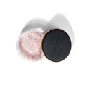Makeup product with black lid and rose gold accents on a white background