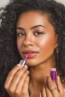 YB Cosmetics Lip Oil on model in Bitten Berry