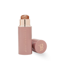 Crème highlighter stick with bronze shimmer and cap off