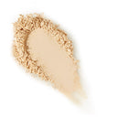 Beige makeup powder on a white background