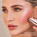 Pro Sculpt® Crème Contour Stick in medium bronze applied on model's cheek