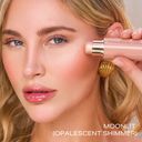 Pro Glow Crème Highlighter Stick® in Moonlit, applied to cheek