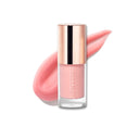 Lip oil with a rose gold cap on a white background