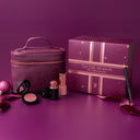 Little luxuries makeup set with a purple bag and box on a matching purple background