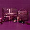 'Tis the Season' gift box on a purple background