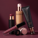 Makeup complexion set with BEYOND BLUR foundation bottle, primer tube, and compact