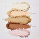 Loose mineral powder shade swatches: light, medium, tan, dark/deep, pink