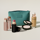 Five YB products with a teal makeup pouch