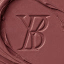 Close-up of a gelato color swatch with a YB logo.