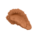 Loose mineral foundation powder swatch, deep tan-brown powder scoop with texture
