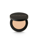 Concealer compact in light beige shade with black lid and round pan